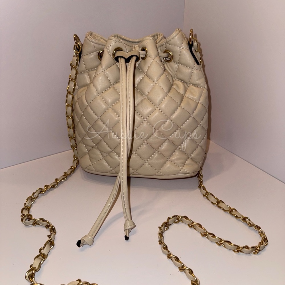 Elegant Cream or Tan Quilted Bucket Bag with Gold Accents & Maroon Interior